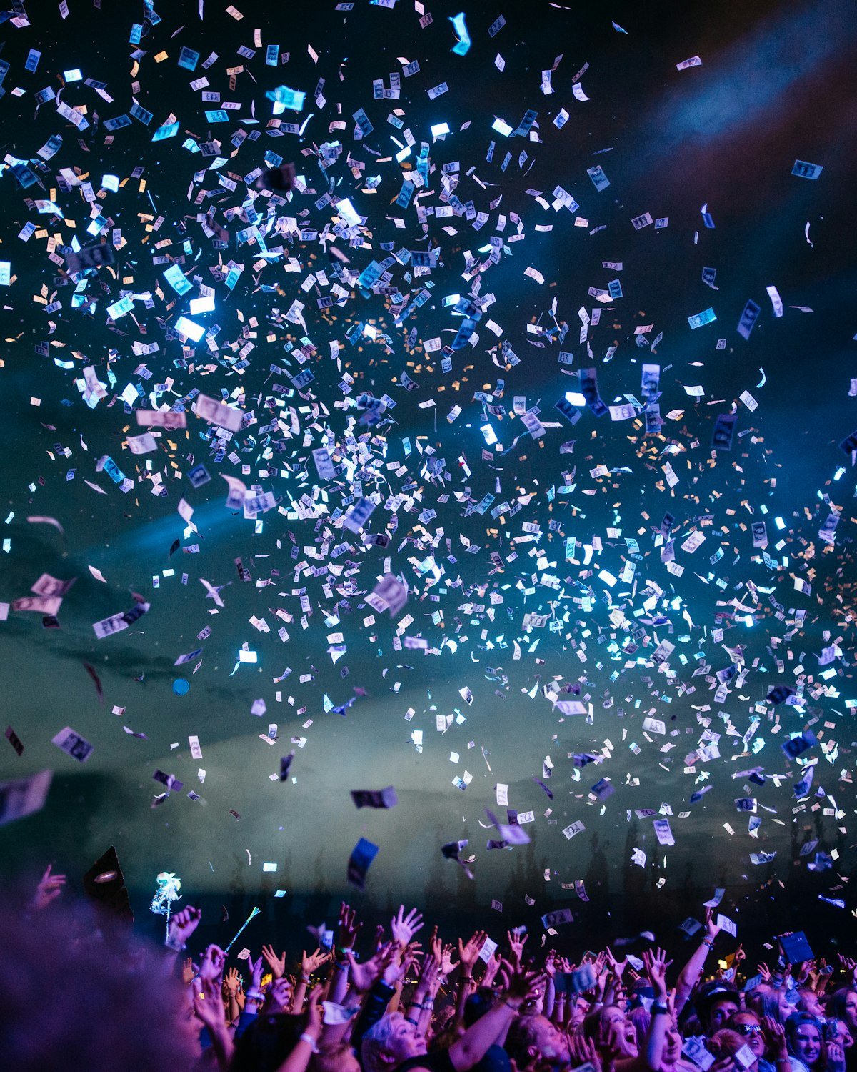 Confetti falling over a crowd at a live show