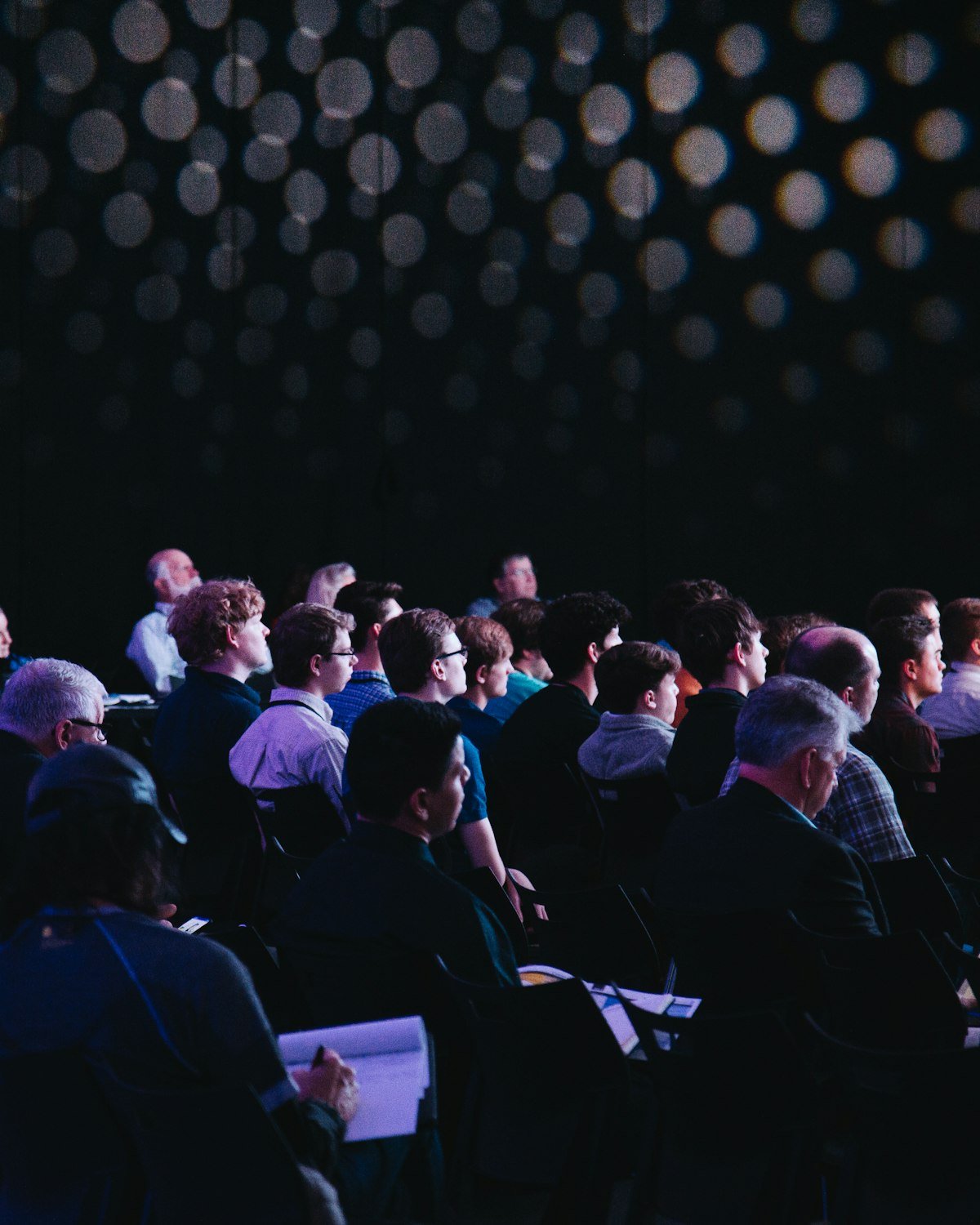 Audience seated at a conference talk