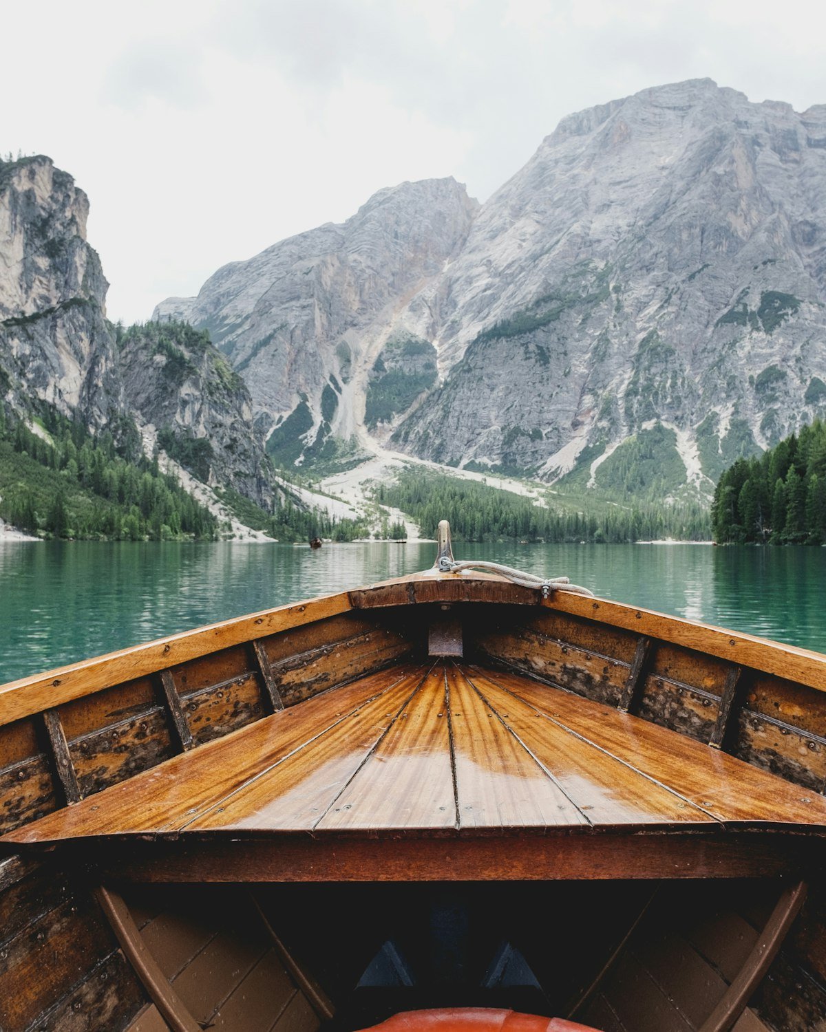 Wooden boat on a calm mountain lake